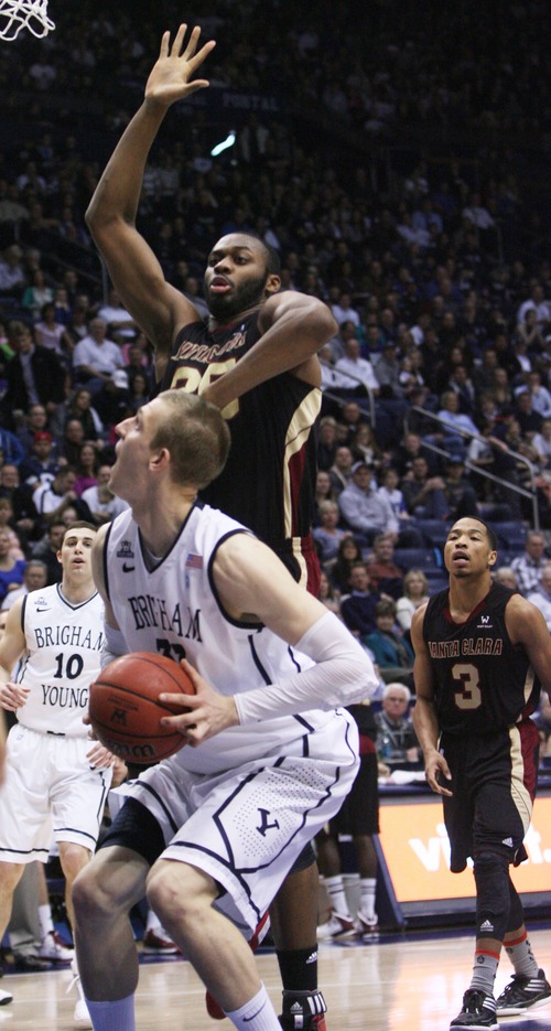 Kim Raff  |  The Salt Lake Tribune
Brigham Young Cougars forward Nate Austin (33) looks for the basket as (back) Santa Clara Broncos center Robert Garrett (35) defends during a game at the Marriott Center in Provo on February 2, 2013.