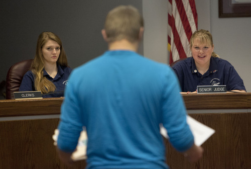 Steve Griffin  |  The Salt Lake Tribune
Layton Youth Court members Sarah Chamberlain, 15, and Hayley Tomney, 18, listen to a respondent during court in Layton, Utah Wednesday, January 23, 2013. The youth court is celebrating its 15th year. It is an alternative to juvenile court for first-time minor youth offenders. The court also keeps youth from getting permanent criminal records through alternative punishment.