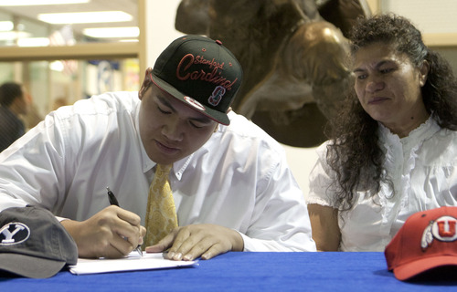 Jason Olson | Special to the Tribune

Pleasant Grove High School's Brandon Fanaika signs a letter of intent durning a ceremony at the high school Wednesday, Feb. 1, 2012, committing to play football for Stanford University. With Fanaika is his mother Navu, at right. Brandon is one of many Polynesian athletes from Utah who have helped elevate football in the state.