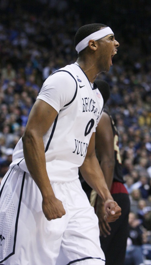 Kim Raff  |  The Salt Lake Tribune
Brigham Young Cougars forward Brandon Davies (0) reacts after dunking the ball during a game against the Santa Clara Broncos at the Marriott Center in Provo on February 2, 2013.  BYU went on to win 96-79.