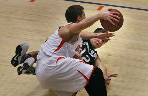 Scott Sommerdorf   |  The Salt Lake Tribune
Brighton's Brandon Miller, foreground, gets tangled up with Alta's RJ Beard during a first half loose ball. Alta led Brighton 34-25 at the half at Brighton High, Friday, February 1, 2013.