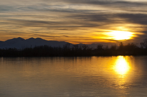 Chris Detrick  |  The Salt Lake Tribune
The sun sets over Bountiful Lake along the Legacy Parkway in December 2012.