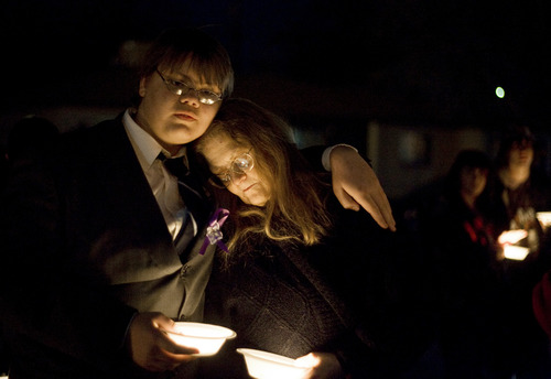 Kim Raff  |  The Salt Lake Tribune
Mathew Owings, left, stands with his mother, JoVanna Owings, at a vigil for the Powell family after the fire at Josh Powell's house that killed him and his two sons, Charlie and Braden. The vigil was at Oquirrh Hills Elementary in Kearns on Sunday. JoVanna Owings was a friend to Susan Powell and was the last person she talked to before she disappeared in 2009.