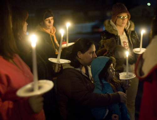 Kim Raff  |  The Salt Lake Tribune
Cheyenne Miller, left, stands with her daughter Brooklyn Miller at a vigil Sunday she organized for the Powell family after the fire at Josh Powell's house that killed him and his sons, Charlie and Braden.