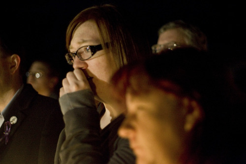 Kim Raff  |  The Salt Lake Tribune
Tonya McMullin becomes emotional at a vigil for the Powell family at Oquirrh Hills Elementary in Kearns on Sunday night.