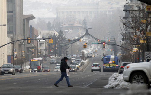 Al Hartmann  |  The Salt Lake Tribune
Commuters go to work in downtown Salt Lake City Tuesday, Feb. 5, 2013, on a foggy morning with another air quality action day with unhealthy air for sensitive groups building up during the day. A rally critical of the state's efforts on reducing air pollution is set for noon Wednesday.