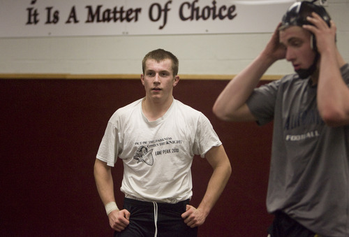 Kim Raff  |  The Salt Lake Tribune
Trenton Colton, a senior captian of the wrestling team at Lone Peak High School, waits for the next drill to start during practice in Highland  on February 4, 2013.