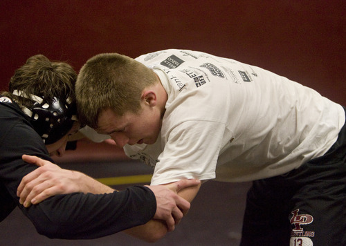 Kim Raff  |  The Salt Lake Tribune
(right) Trenton Colton, a senior captian of the wrestling team at Lone Peak High School, practices with Cole Johnson in Highland on February 4, 2013.