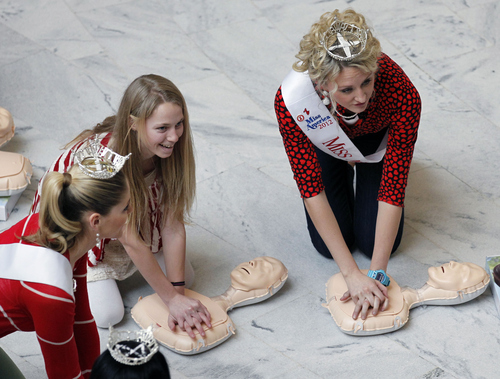 Al Hartmann  |  The Salt Lake Tribune
Folks practice CPR on dummies on the floor of the capitol rotunda Friday, Feb. 1 for "Heart on the HIll."  The American Heart Association and local hospitals encouraged people to dress in red, get their blood pressure, BMI and cholesterol checked to promote good heart health.