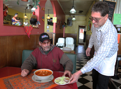 Rick Egan  | The Salt Lake Tribune 

Ray Anderson dishes up posole to Don Gohees at Taco Taco on Washington Boulevard in Ogden.