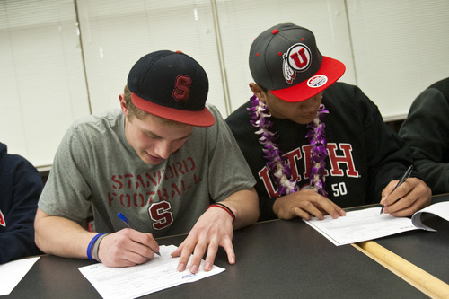 Chris Detrick  |  The Salt Lake Tribune
Sean Barton and Filipo Mokofisi sign their letter of intent at Woods Cross High School on National Signing Day Wednesday February 6, 2013. Barton will be playing football at Stanford and Mokofisi will be playing football at University of Utah.