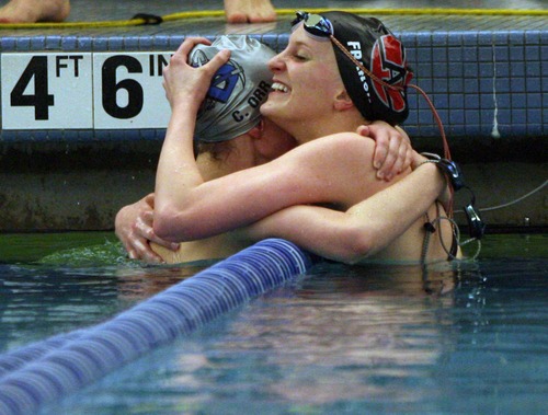 Kim Raff  |  The Salt Lake Tribune
(right) Brianna Francis, of Alta High School, hugs Ciera Orr, of Bingham,  women's 200 yard IM Utah High School State 5A Championship swim meet at the Stephen L. Richards Building on the BYU campus in Provo on February 7, 2013. Francis received first place and Orr received third in the event.