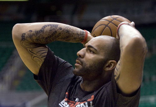 Kim Raff  |  The Salt Lake Tribune
Chicago Bulls power forward Carlos Boozer (5) shoots the ball during warmups before a game against the Utah Jazz at EnergySolutions Arena in Salt Lake City on February 8, 2013.