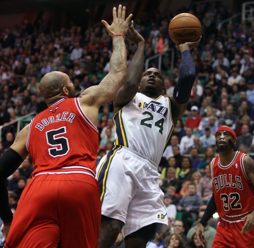 Kim Raff  |  The Salt Lake Tribune
(middle) Utah Jazz power forward Paul Millsap (24) takes a shot as he is defended by (left) Chicago Bulls power forward Carlos Boozer (5) and as (right) Chicago Bulls shooting guard Richard Hamilton (32) looks on during the first quarter at EnergySolutions Arena in Salt Lake City on February 8, 2013.
