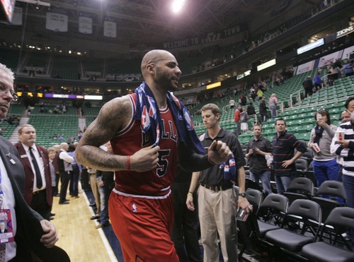 Kim Raff  |  The Salt Lake Tribune
Chicago Bulls power forward Carlos Boozer (5) walks off the court after the Chicago Bulls defeated the Utah Jazz 93-89 at EnergySolutions Arena in Salt Lake City on February 8, 2013.