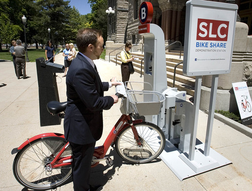 Paul Fraughton | Tribune file photo
Bike Share Project Manager Ben Bolte demonstrates how to use a bike-share station during a 2012 press conference. Bike Share will begin in Salt Lake City in March 2013.