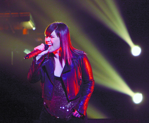Steve Griffin  |  The Salt Lake Tribune

Kelly Clarkson sings to the crowd during her concert at the Maverik Center in West Valley City in 2012. Her "Stronger (What Doesn't Kill You)" is nominated for Record of the Year.