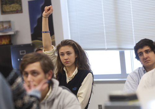 Juan Diego Catholic High School junior Caitlin Keenan asks a question during her class discussion on Pope Benedict XVI's resignation.  The class, already focusing their week's studies on the papacies, talked about the historical and dramatic moment that the world was witnessing.  (CAYCE CLIFFORD/Special to The Tribune)