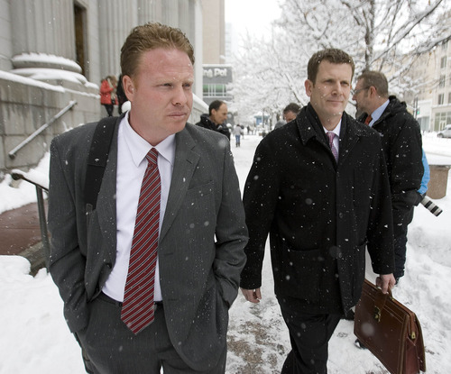 Paul Fraughton  |   Salt Lake Tribune
Jeremy Johnson, left, leaves the federal court building in Salt Lake City with his lawyer Nathan Crane on Friday, January 11, 2013