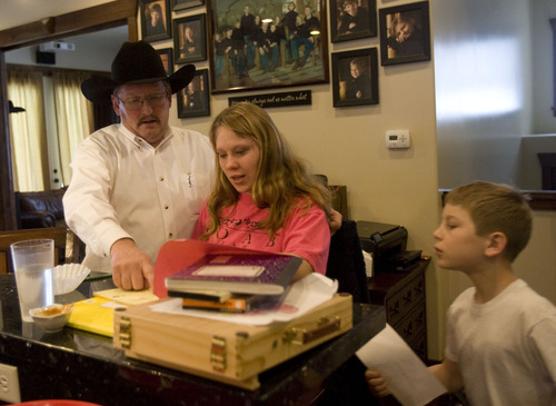 Kim Raff  |  The Salt Lake Tribune
John Simmons talks with his adopted children Annie and Denney at their home in Kamas on January 24, 2013. The Simmonses have nine children with five adopted from Russia, including Annie and Denney.