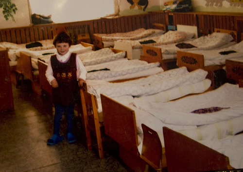 Kim Raff  |  The Salt Lake Tribune
Sarah Simmons stands at her bed in the orphanage where she was adopted in Partizansk, Russia. John and Amy Simmons have nine children with five adopted from Russia, including Sarah and three of her biological sisters.