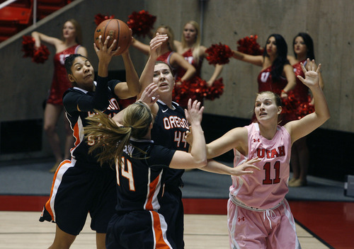 Scott Sommerdorf   |  The Salt Lake Tribune
Utah's Taryn Wicijowski, right, loses out on a rebound attempt during first half play. Utah beat Oregon State 66-40, Sunday, February 10, 2013.