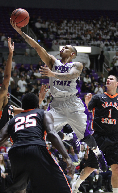 Rick Egan  | The Salt Lake Tribune 

Weber State Wildcats guard Gelaun Wheelwright (0) takes the ball inside for a lay-up, in basketball action at the Dee Event Center in Ogden, Monday, February 11, 2013.