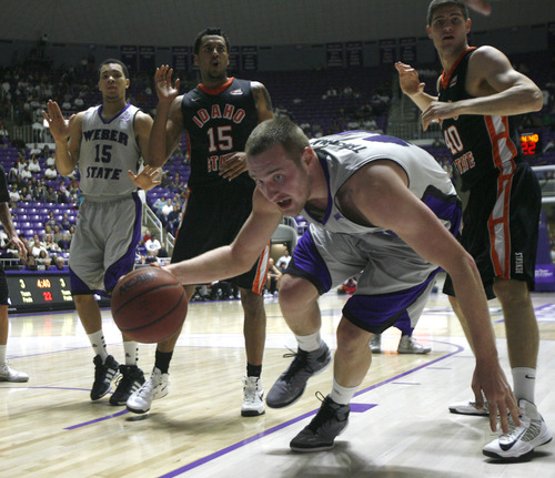 Rick Egan  | The Salt Lake Tribune 

Weber State Wildcats center Kyle Tresnak (44) tries to keep control of the ball, in basketball action at the Dee Event Center in Ogden, Monday, February 11, 2013.