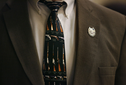 Scott Sommerdorf   |  The Salt Lake Tribune
Clark Aposhian sometimes chooses to wear gun-themed ties as he spends his days at the Utah legislature. This one, he said is one of his favorites, Wednesday, February 6, 2013. Aposhian spends long days at the capitol every day during the legislative session advocating for gun rights, and often legislators stop by to speak to him.