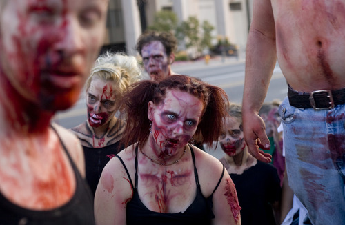 Kim Raff | The Salt Lake Tribune
People dressed as zombies walk on North Temple during the Salt Lake City Zombie Walk in Salt Lake City in August.