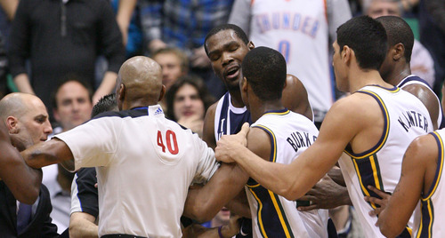 Steve Griffin | The Salt Lake Tribune


The referees try to separate Jazz players from the Thunder's Kevin Durant after Durant fouled Utah's Alec Burks during a game in Salt Lake City on Tuesday, Feb. 12, 2013.