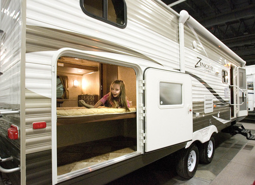 Paul Fraughton  |   Salt Lake Tribune
Kyla Dawson, age 5,  visiting the  Utah Sportsman's Vacation and RV Show with her grandparents, tries out the sleeping quarters  in one of the hundreds of RV's,  motor homes, and trailers on display at the South Towne Expo Center in Sandy. The show  continues through Sunday. 
 Thursday, February 14, 2013