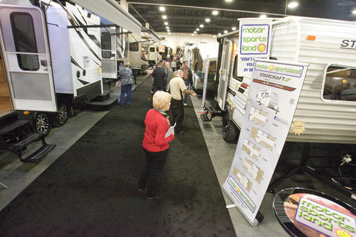 Paul Fraughton  |   Salt Lake Tribune
Visitors walk down the aisles filled with hundreds of  RV's at the Sportsman's Vacation and RV Show at the  South Towne Expo Center.  THe show continues through Sunday. 
 Thursday, February 14, 2013