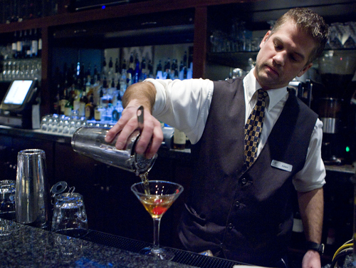 Keith Johnson | The Salt Lake Tribune

Adam Takoch prepares the "Lincoln" cocktail at The Vault bar in the Hotel Monaco in Salt Lake City.