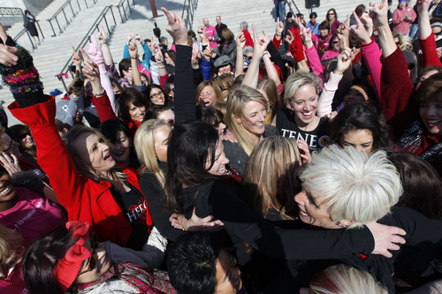 Al Hartmann  |  The Salt Lake Tribune
Women hug and celebrate after doing a zumba dance routine on the south steps of the Utah State Capitol Thursday February 14 to raise awareness about violence against girls and women. Hundreds of dance demonstrations took place around the world for "One Billion Rising" a campaign on Valentine's Day to end violence against women and girls. It was sponsored by the YWCA and other nonprofits.