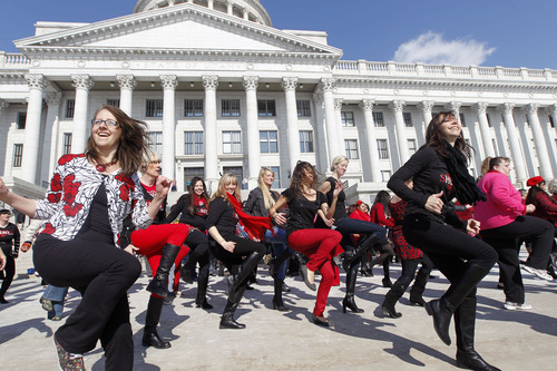 Al Hartmann  |  The Salt Lake Tribune
About 100 dancers do zumba dance moves on the south steps of the Utah State Capitol Thursday February 14 to raise awareness about violence against girls and women. Hundreds of dance demonstrations took place around the world for "One Billion Rising"  on Valentine's Day a campaign to end violence against women and girls. It was sponsored by the YWCA and other nonprofits.