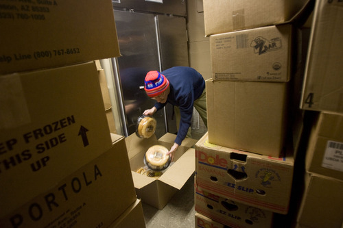 Kim Raff  |  The Salt Lake Tribune
Paul Perry sorts boxes of food at Jesus Feeds Food Bank at The Church at Liberty Park in Salt Lake City on February 14, 2013. Utah generated a lot of jobs last year but still there is a growing need at area food banks.