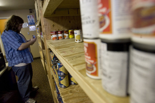 Kim Raff  |  The Salt Lake Tribune
Paul Perry Jr. shelves donated food items at Jesus Feeds Food Bank at The Church at Liberty Park in Salt Lake City on February 14, 2013. Utah generated a lot of jobs last year but still there is a growing need at area food banks.