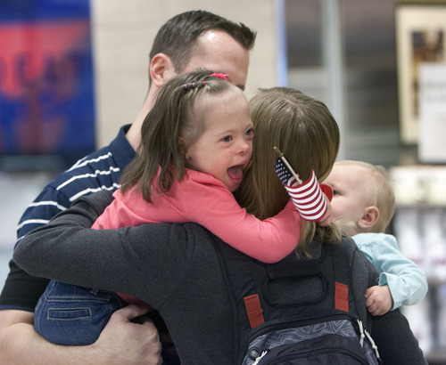 Steve Griffin  |  The Salt Lake Tribune
Jaymi Bonner hugs her mother, Jeana Bonner, as she meets her dad, Wayne, and sister, Bryne, as she arrives at the main terminal at the Salt Lake City International Airport in Salt Lake City, Utah Thursday, February 14, 2013. The mother and daughter arrived home today after weeks spent in Russia trying to finalize the adoption of 5-year-old Jaymi, who has Down syndrome. The Russian government in January approved a ban on adoptions by U.S. citizens but agreed to let adoptions that were already basically completed to proceed. This was one of about 50 adoptions allowed to move forward.