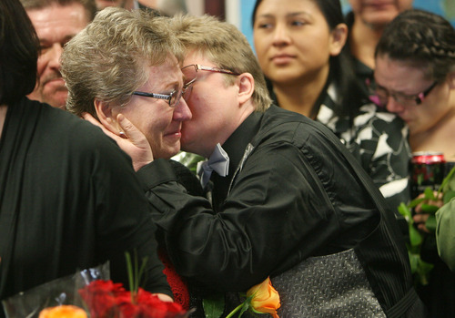 Steve Griffin  |  The Salt Lake Tribune
Angelika Bertrand kisses her partner, Kaye Terry, as Terry starts to cry, while they wait in line to apply for a marriage certificate with other same sex-couples during the "Standing on the Side of Love" marriage equality rally at the Salt Lake County Government Center  in Salt Lake City on Thursday. Several same-sex couples attended the rally and applied for marriage licenses. They were politely informed of Utah state statute prohibiting marriage between persons of the same sex.