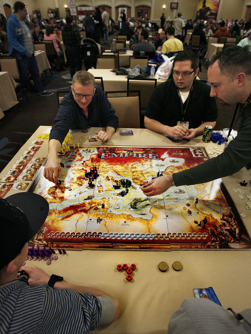 Scott Sommerdorf   |  The Salt Lake Tribune
A game of "Conquest of the Empire" is under way at SaltCON 2013, a board game convention at the Sheraton Salt Lake City Hotel on Saturday, Feb. 15, 2013. Clockwise from upper left are; Brandon Erwin, Tom Morelo, Steve Suggs and Tyler Thompson at lower left.