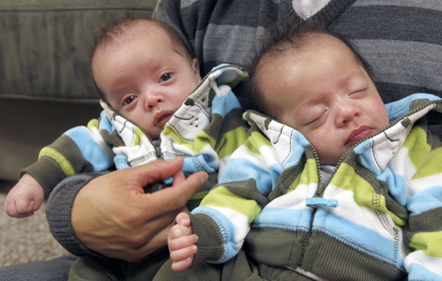 Al Hartmann  |  The Salt Lake Tribune
Utah couple Charlie and Kelley Sandness have their hands full with quadruplets. The two boys are Andrew, left, and Mason.