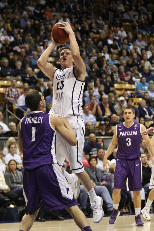 Rick Egan  | The Salt Lake Tribune 

Brigham Young Cougars guard Brock Zylstra (13) shoots over Portland Pilots guard Bryce Pressley (1) as the BYU Cougars faced the Portland Pilots, at the Marriott Center, Saturday, February 16, 2013.