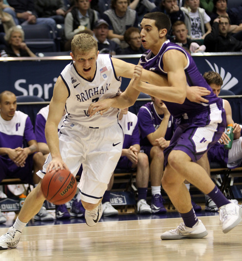 Rick Egan  | The Salt Lake Tribune 

Brigham Young Cougars guard Tyler Haws (3) tries to get past Portland Pilots guard Bryce Pressley (1) as the BYU Cougars faced the Portland Pilots, at the Marriott Center, Saturday, February 16, 2013.