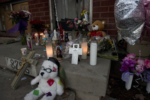 Kim Raff  |  The Salt Lake Tribune
Candles and other items honoring shooting victims Danielle Lucero, Omar Jarman and Shontay Young are placed on the front steps of the Midvale home where they were slain.