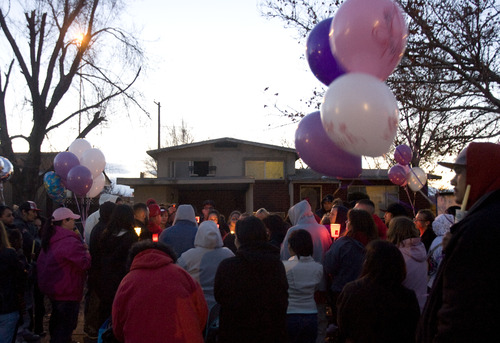 Kim Raff  |  The Salt Lake Tribune
Friends and family of Danielle Lucero gather for a candlelight vigil Sunday at the Midvale home where Lucero, Omar Jarman and Shontay Young were slain.