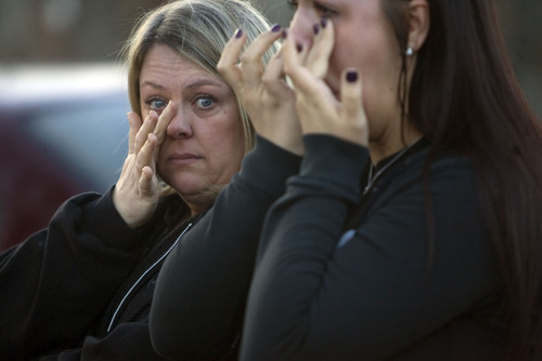 Kim Raff  |  The Salt Lake Tribune
Mary Beltran, left, and her daughter Lachele Beltran, neighbors of Danielle Lucero, wipe away tears during for a candlelight vigil Sunday at the Midvale home where Lucero, Omar Jarman and Shontay Young were slain.