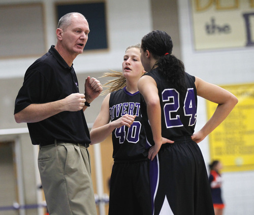 Al Hartmann  |  The Salt Lake Tribune
Riverton High School Coach Ron Ence gives instructions to Whitney Saunders and Shelby Richards at the 5A girls' playoff game at Salt Lake Community College Monday February 18.