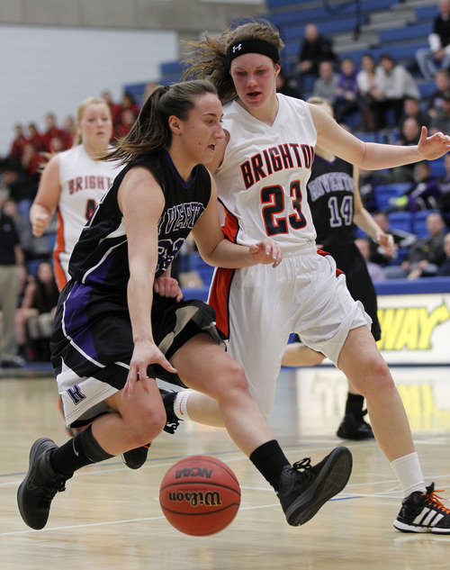 Al Hartmann  |  The Salt Lake Tribune
Riverton High School's Kyle Currie gets chased down by Brighton High School's Lindsey Johnson at the 5A girls' playoff game at Salt Lake Community College Monday February 18.