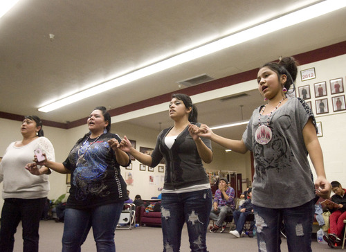 Kim Raff  |  The Salt Lake Tribune
People dance as drummers perform and sing during a Round Dance, organized by members of the Ute Indian Tribe, at Uinta River High School in Fort Duchesne on Feb. 9, 2013.